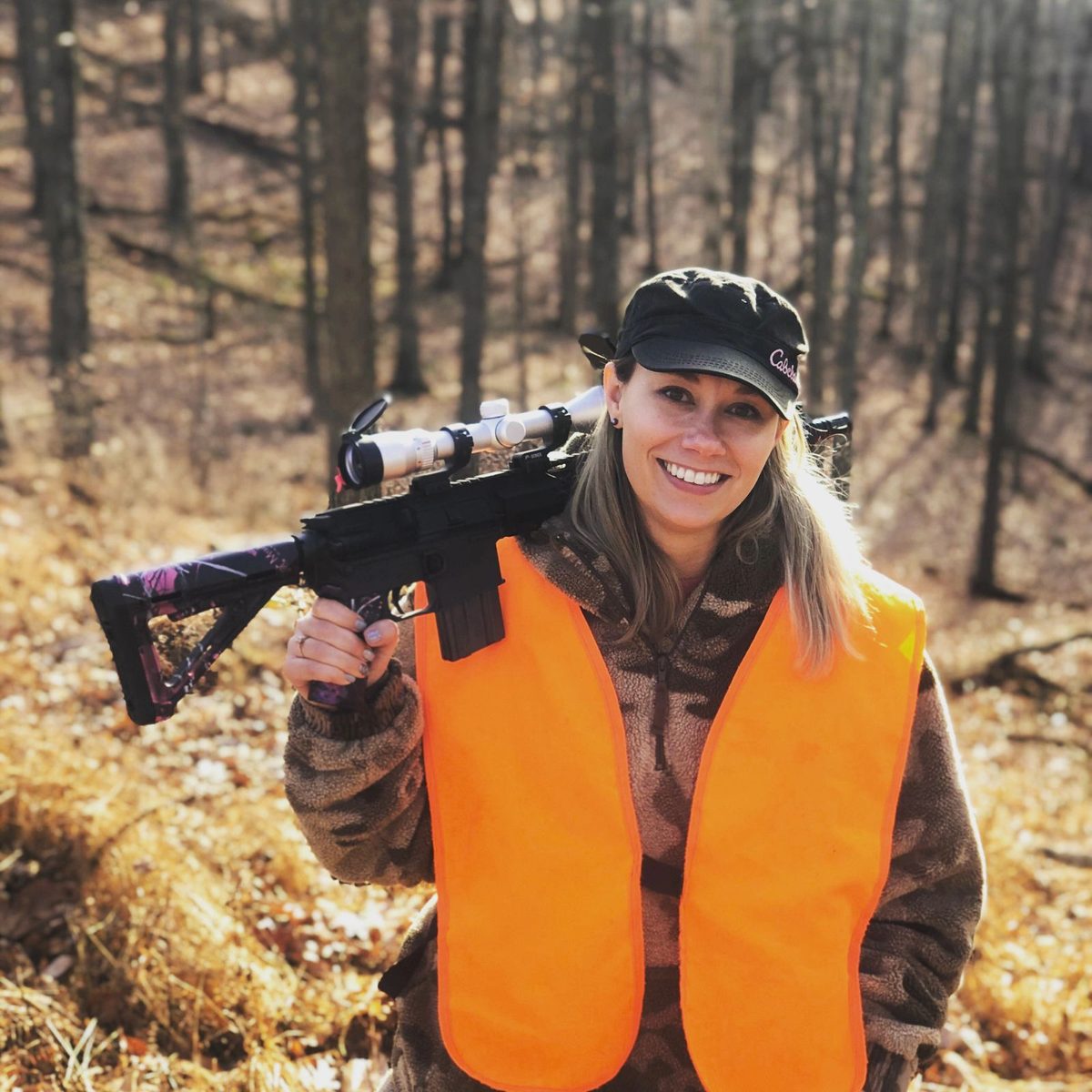 Sabrina Haught deer hunting in blaze orange in the West Virginia woods